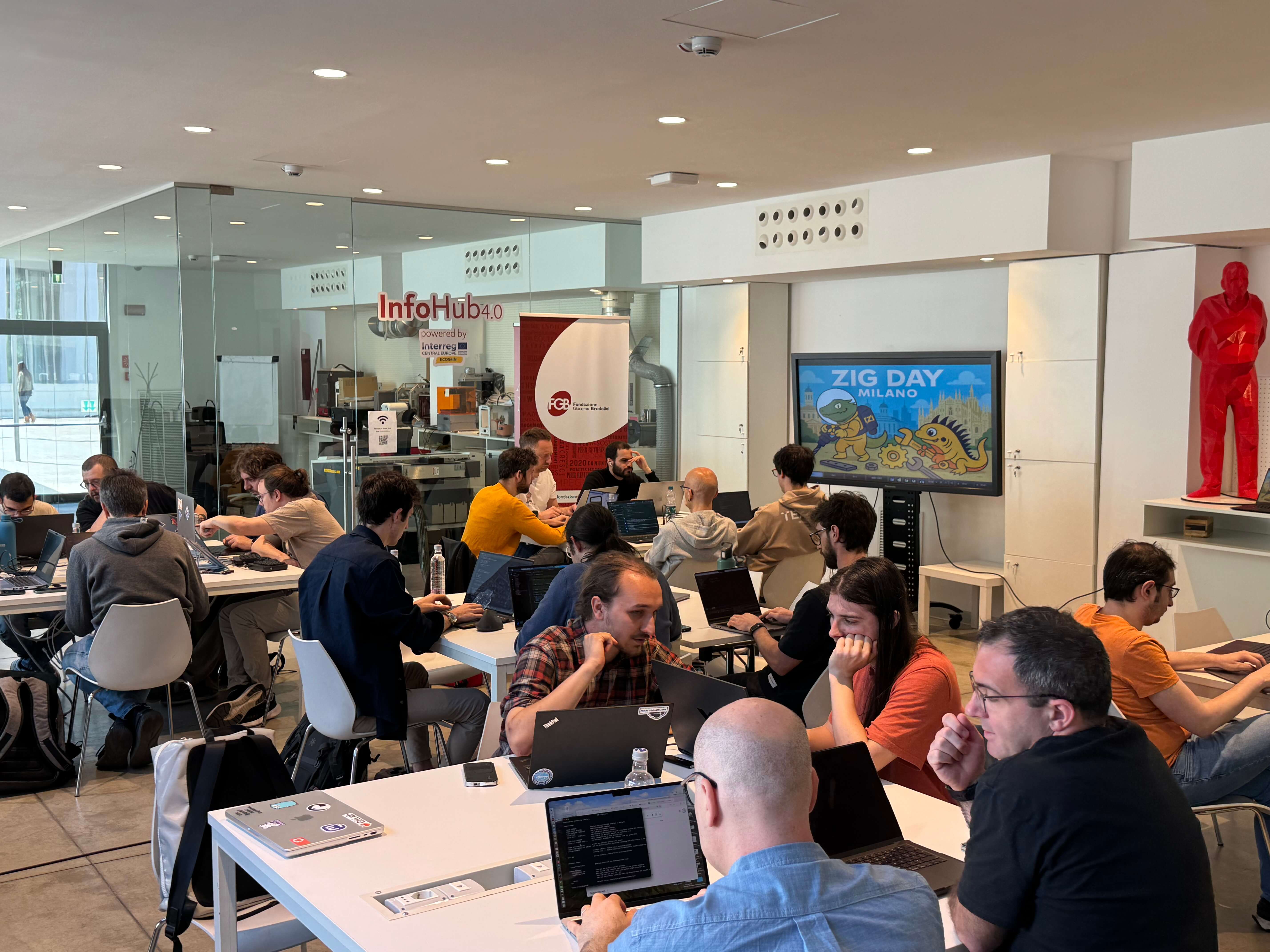 group photo 2, all the groups of folks intensely developing Zig code on their laptos