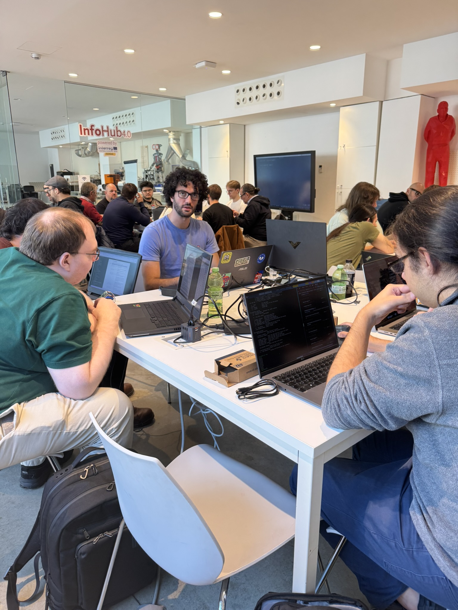 Jacob and Mattia developing on a microcontroller, Mirko from Zant