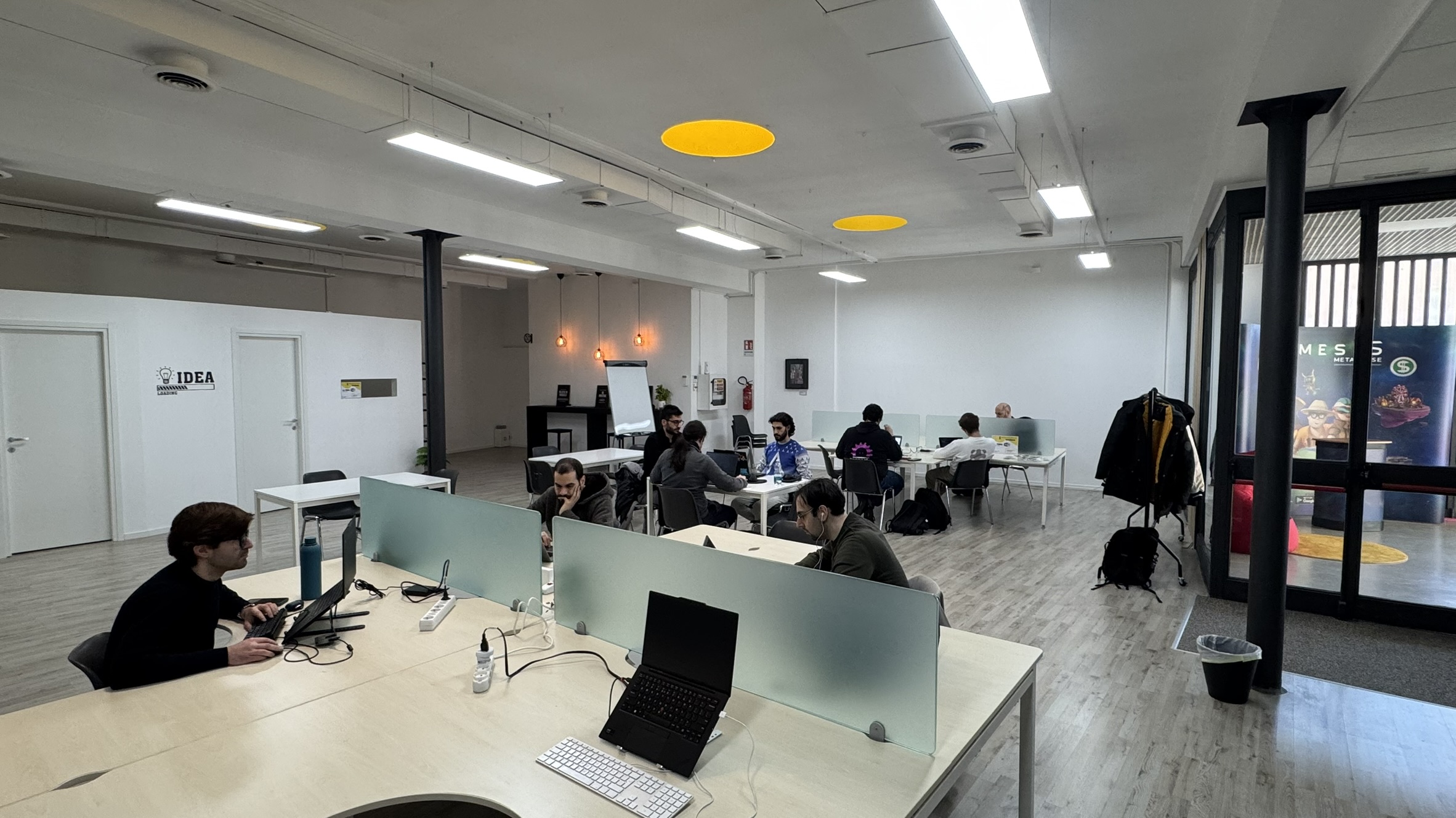 People sitting at desk and developing Zig on PCs